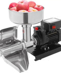 Heavy Duty Electric Tomato Sauce Maker And Fruit Strainer with apples in the stainless steel funnel, 450W motor attached.