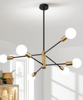 View of Sputnik Style 6 Light Modern Gold and Black Chandelier with rotatable arms in a dining room setting.