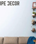 Hella Sturdy Industrial Pipe Shelf Brackets Six Inch Four Pack wall mounted with floating shelves, featuring plants and decor items.