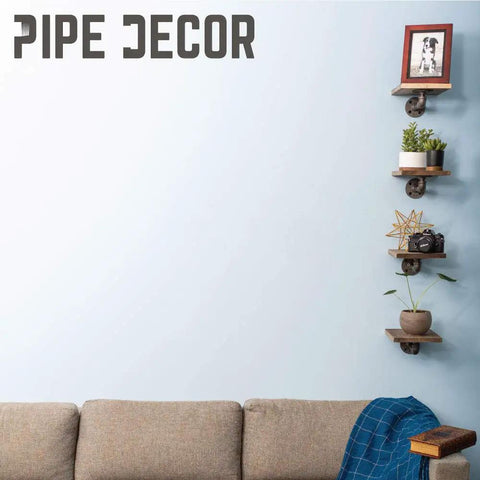 Hella Sturdy Industrial Pipe Shelf Brackets Six Inch Four Pack wall mounted with floating shelves, featuring plants and decor items.