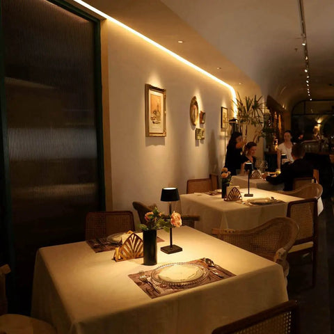 Restaurant setting with a cordless table lamp with 6000mAh battery IP54 waterproof all aluminum body touch dimming warm light on table
