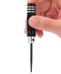 Hand holding a tool from the 7 Piece Hex Slot Cross Bit Set With High Speed Steel Bits And Aluminum Alloy Handles For RC Models Drones Aircraft And Robot Maintenance Pro Grade Tools Lightweight Ergonomic Durable And Ready For Precision Work.