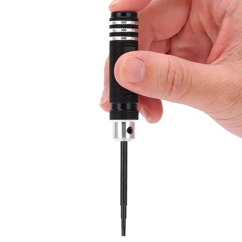 Hand holding a tool from the 7 Piece Hex Slot Cross Bit Set With High Speed Steel Bits And Aluminum Alloy Handles For RC Models Drones Aircraft And Robot Maintenance Pro Grade Tools Lightweight Ergonomic Durable And Ready For Precision Work.