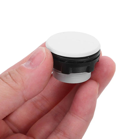 Heavy-Duty Plastic Push Button Switch Hole Plugs Pack 50, Waterproof Moisture-Resistant Cap Seals For Industrial Control Panels And Distribution Boxes, Abrasion-Resistant, Easy Install, Universal Fit For Panel Holes; black and white plastic plug held in hand