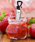 Hand using Stainless Steel Candy And Deep Fry Thermometer With Pot Clip And Handle in strawberry jam