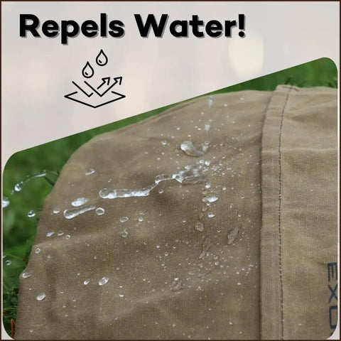 Close-up of water droplets on Waxed Canvas Haversack Outdoor Bushcraft Shoulder Bag And Messenger Satchel Water Resistant Built To Last Utility Pack For Gardening And Foraging Large 17 By 15 Inches Dark Khaki, showing water resistance.