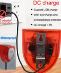 Rear view of All Weather Water Level Alarm with Dual Probes, showing DC charge input and IP55 waterproof label, plugged into an outlet.