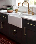 Brushed Gold Cabinet Pulls 5 Inch Zinc Alloy Handles Set of 10 for Kitchen Cabinets Bathrooms Drawers Cupboards and Wardrobes Go To Sleek Durable Easy Install Hardware installed on dark kitchen cabinets under white countertop