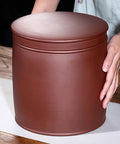 Heavy Hitter Ceramic Rice Jar Round With No Sweat Seal, retro brown storage for grains held by a person on a wooden table.