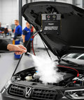 Heavy Duty Smoke Machine Leak Detector With Built In Pump Tracks Down Sneaky Automotive And Home Leaks In Thirty Seconds For Quick Under The Hood Repairs in use with smoke emanating from engine.