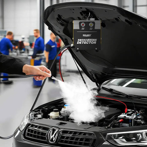 Heavy Duty Smoke Machine Leak Detector With Built In Pump Tracks Down Sneaky Automotive And Home Leaks In Thirty Seconds For Quick Under The Hood Repairs in use with smoke emanating from engine.