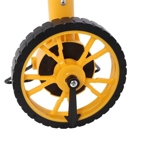 Close-up of Yosoo Health Gear Digital Measuring Wheel With Backlit Display showing the sturdy yellow wheel design for accurate distance measurement.