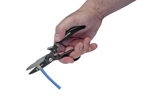Hand using spring-loaded scissors from 5 Piece Cable Splicing Kit With Spring Loaded Scissors LED Pen Light And Durable Leather Pouch