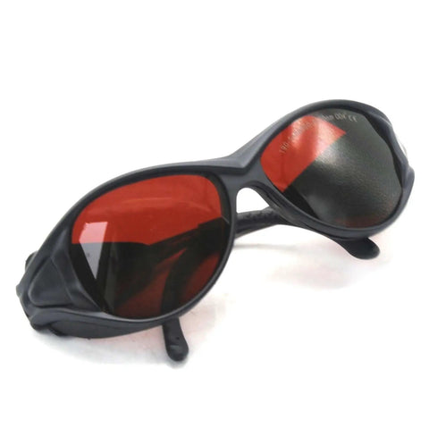 Badass OD4 Plus Laser Safety Goggles Offering Rock Solid Eye Shield From UV Through Near Infrared Bands Designed For Heavy Duty Lab Work And Precision Manufacturing Delivering Top Tier Rad Protection For Pros Who Crave Zero Compromise Performance, black frame, red lenses.