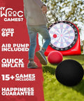 Person playing with Inflatable Giant Kick Darts Set With Jumbo Soccer Dartboard and air pump outdoors, featuring two balls.