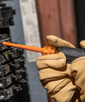 Worker uses Pro Grade 1000V Insulated Screwdriver Set with Pliers and Wire Stripper for safe electrical panel work.