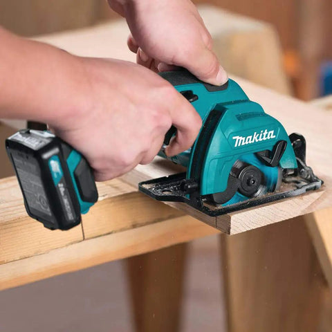 User operating Cordless 12V Max Circular Saw Kit With Three-Eighths Inch Blade, 1500 RPM, One-Inch Depth at 90 Degrees on wood