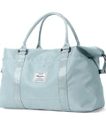 Light blue Large Duffle Bag For Women With Six Interior Pockets And Two Exterior Compartments Water Resistant Weekender Carry On Tote