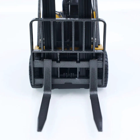 Mini Warehouse RC Forklift Model 9925 With Realistic Light And Sound Effects Precise Steering Lift Lower Function Plus Remote Control Operation For Indoor Play front view showing realistic forks and wheels.