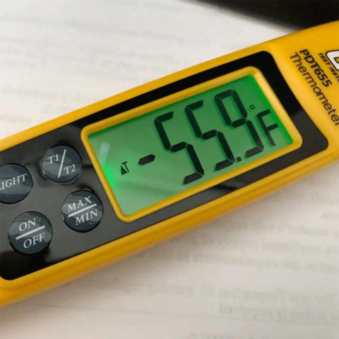 Close-up of HVAC Differential Temperature Folding Pocket Thermometer with backlit display showing -55.9°F, buttons visible