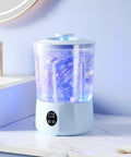 Hassle Free Cordless Mini Washing Machine With Rechargeable Battery And Three Wash Modes For Underwear Socks And Daily Threads Compact Dorm And Camp Ready Laundry Rig on countertop with blue light.