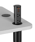 No Sweat Install 2 Inch Pop Up Receptacle For Countertops And Desks, spring loaded design with USB and AC outlets on a desk.