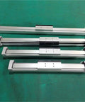 Top Shelf Pneumatic Rodless Cylinder Featuring Precision Linear Guide For Smooth Straight Stroke Motion Control 18 25 32 40mm heavy-duty actuators on a green background.