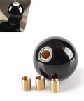Classic 8 Ball Shift Knob For Manual Transmission Gear Shifter With Smooth Acrylic Grip And 3 Versatile Threaded Adapters For Universal Fit. Close-up of black acrylic shift knob with adapters.