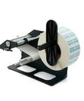 Automatic Peeling Machine For Round Sealing Stickers And Label Printers Adjustable Speed Handles Wide Range Of Sizes Efficient Workflow Easy Integration on a black base with a roll of printed labels.