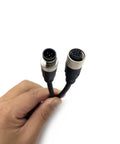 Hand holding 3.28ft M12 5 Pin Cable Connector Straight Aviation Plug Waterproof IP67 Male to Female Sensor PVC Socket 60V 4A