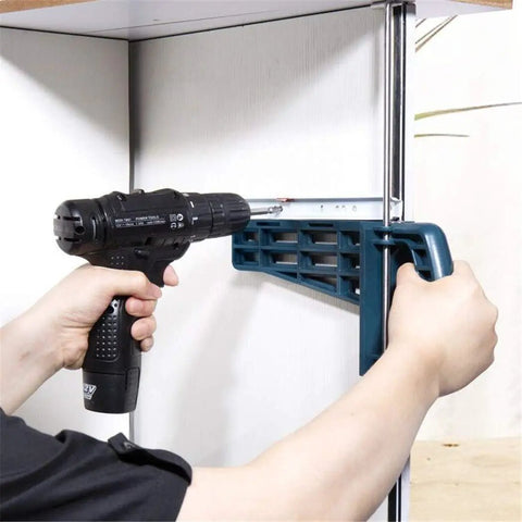 User installing cabinet hardware with Universal Drawer Slide Jig Cabinet Hardware Installation Tool for precise drawer alignment.