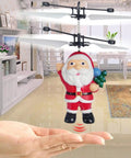 Hand Flying Ball Mini Induction RC Helicopter USB Rechargeable Toy Drone with Santa Claus design, hovering indoors