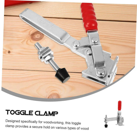 Rust-resistant iron toggle clamp with red ergonomic handle and rubber tips on wooden surface, ideal for workshops.