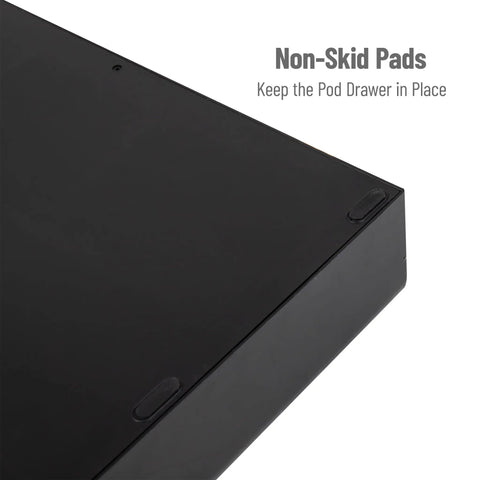 Close-up view of non-skid pads on the 36 Pod Single Serve Coffee Pod Drawer Organizer For Countertop Coffee Station Base, Holds Up To 36 Pods, Black Finish, Easy Access Storage For Your Pods, Space Saving Under Compatible Coffee Brewer.