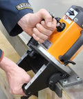 Close-up of Heavy Duty Portable Beveling Machine With 1 HP Brushless Motor 110 Volt Power in use on metal surface.