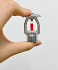 Heavy Duty Brass Upright Fire Sprinkler Head With 155F Automatic Thermal Trigger and Rugged Chrome Finish held in hand.