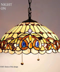 Tiffany Style Pendant Light Fixture Serenity Victorian Stained Glass Hanging Lamp, illuminated, close-up, antique bronze finish.