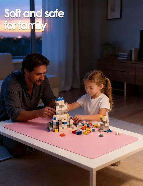 Father and daughter playing with blocks on a Leather Desk Protector Mat For Office And Home Large Mouse Pad Non Slip PU Leather Blotter Waterproof Writing Pad Light Pink 23.6 By 13.8 Inches Perfect For Your Laptop Keyboard And Desk Setup