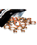 Motor bearings set, stainless steel with ceramic balls, orange seals, spilled from pouch.