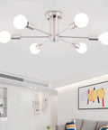 Six Light Nickel Sputnik Ceiling Chandelier With Mid Century Style, shown in a modern living room setting, 21.81in diameter