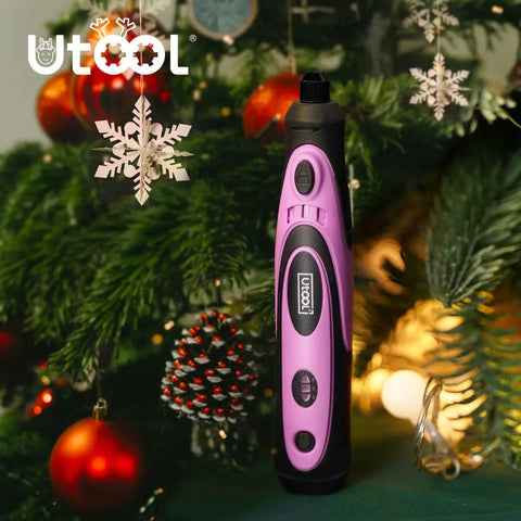 Pink 4V Cordless Rotary Tool Kit with 42 Accessories for DIY crafts, engraving, and polishing, displayed in front of a Christmas tree.