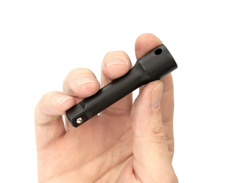 Hand holding a Three Eighths Inch Drive Three Inch Impact Extension Bar For Impact Drivers Adds Reach To Hard To Reach Fasteners