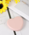 Heart Shaped Portable Travel Sewing Kit For On The Go Fixes Mini Box With Threads Scissors Hand Sewing Needles DIY Repair Tools Pink Compact Handy Essentials For Quick Mends closed on table