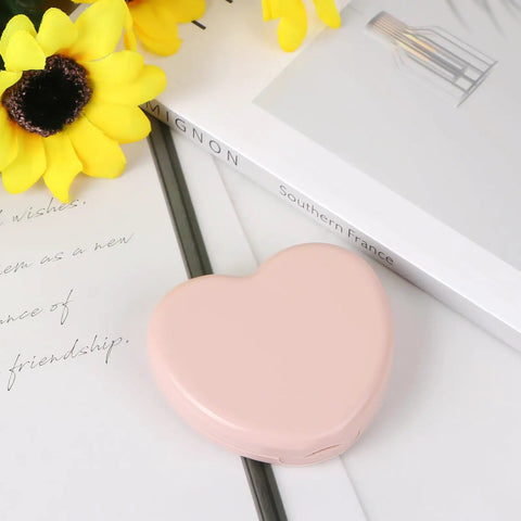 Heart Shaped Portable Travel Sewing Kit For On The Go Fixes Mini Box With Threads Scissors Hand Sewing Needles DIY Repair Tools Pink Compact Handy Essentials For Quick Mends closed on table
