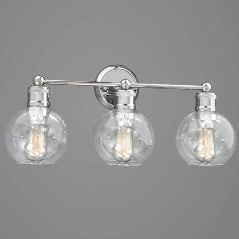 Three Light Coastal Vanity Light With Clear Glass Shades In Polished Nickel Finish illuminates modern beachy bathroom style
