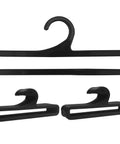 Set Of 50 Black Plastic Hangers For Home And Retail Display, 7.7 Inch Long, shown in a close-up image showcasing three hangers