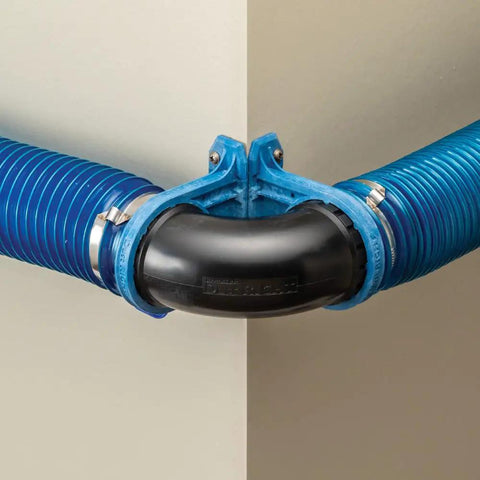 Close-up of Dust Right Ready-Mount 2.5 Inch Vacuum Hose Fitting Brackets with blue hose at corner for dust collection systems.