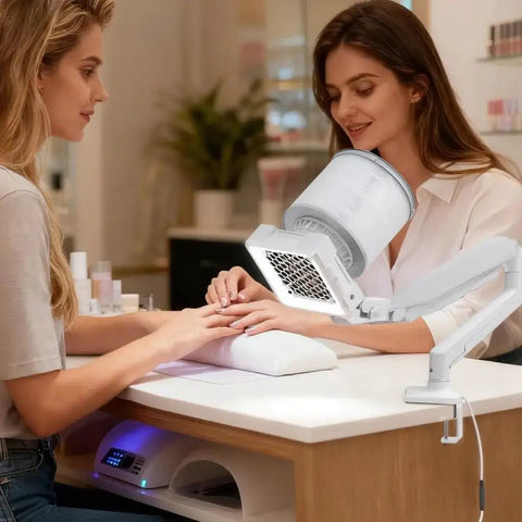 Professional Nail Dust Collector Dishing Out Killer Suction For Talk Friendly Salon Or Home Manicure And Pedicure Sessions Featuring 360 Degree Adjustable Arm Honeycomb Intake For Smooth Gel Acrylic Cleanup in use during a manicure.