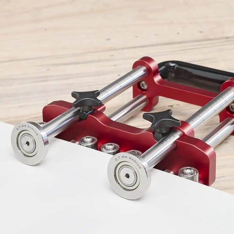 Pro Grade 2 Station Metal Bender, adjustable roller spacing, shown on wooden surface