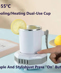 Self Heating And Cooling Smart Mug Keeps Your Beverage On Point With One Button 14 Oz Portable Thermoelectric Cup For Office Desk Home Use Ideal Gift In Fresh Green on a table with lemon slice.